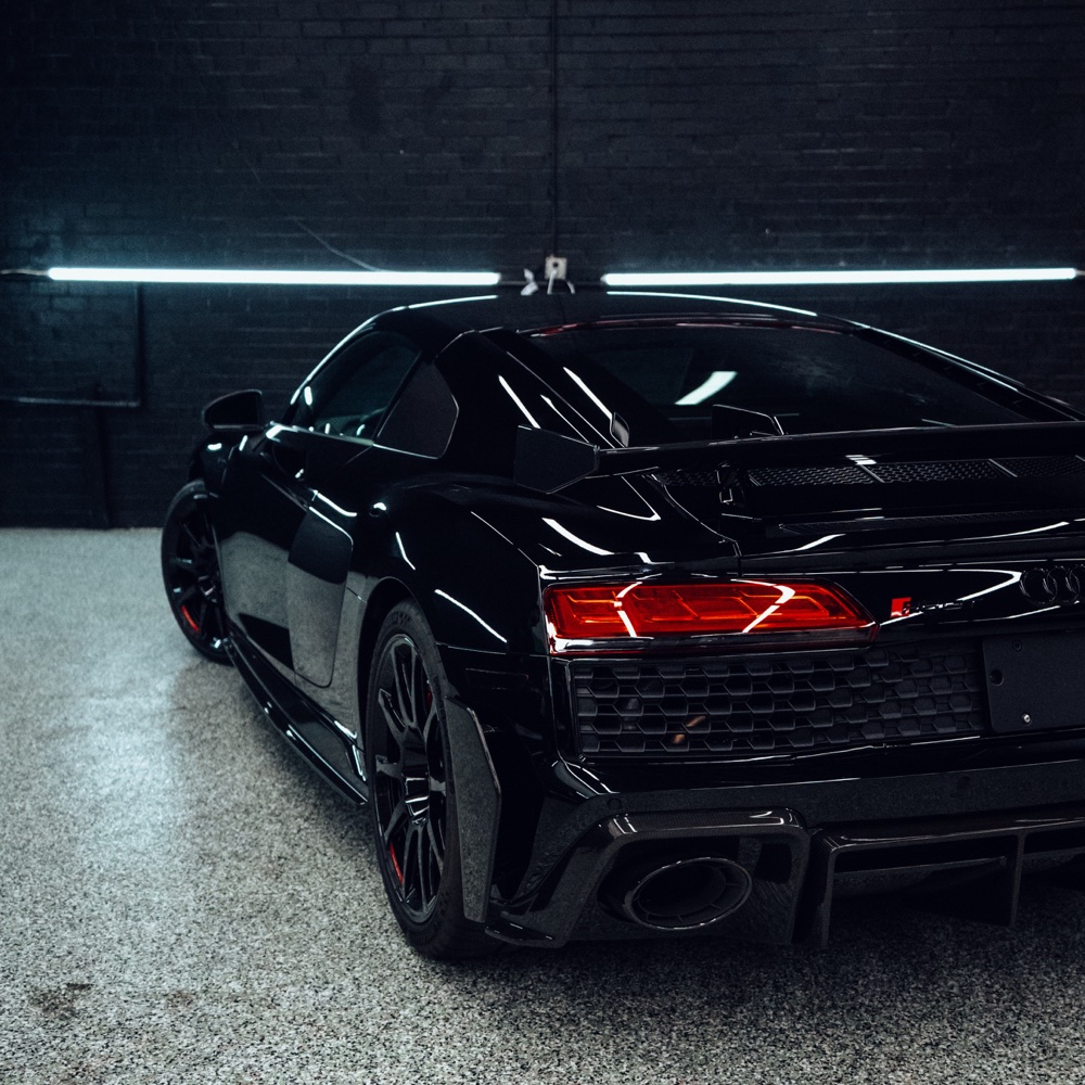 Black Audi R8 showing a reflective protected finish in the ClubExec studio.