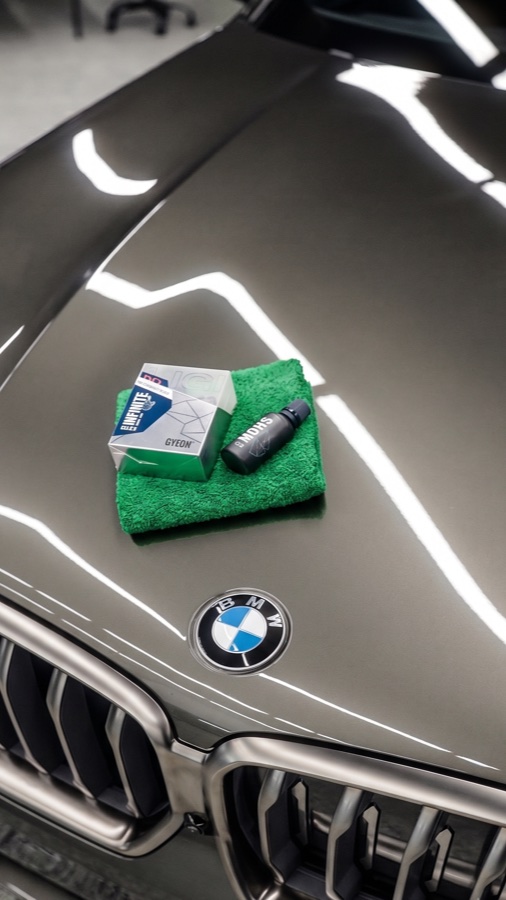 Paint surface being wiped during ceramic coating prep.