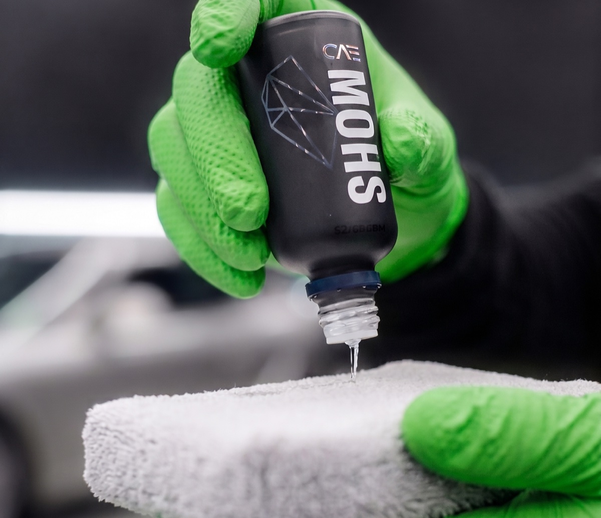 Ceramic coating product being prepared for application.